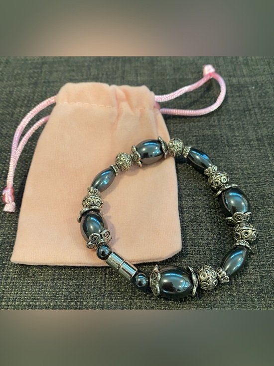 The Unbranded Brand Jewelry - Hematite Beaded 7 inch Bracelet with Silver-Tone Accents & magnetic closure.